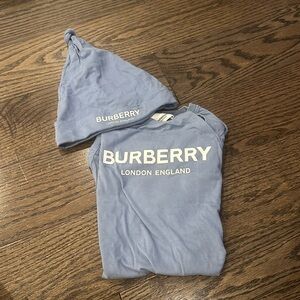 Burberry blue one piece suit with hat. Size 12 months. Never worn.